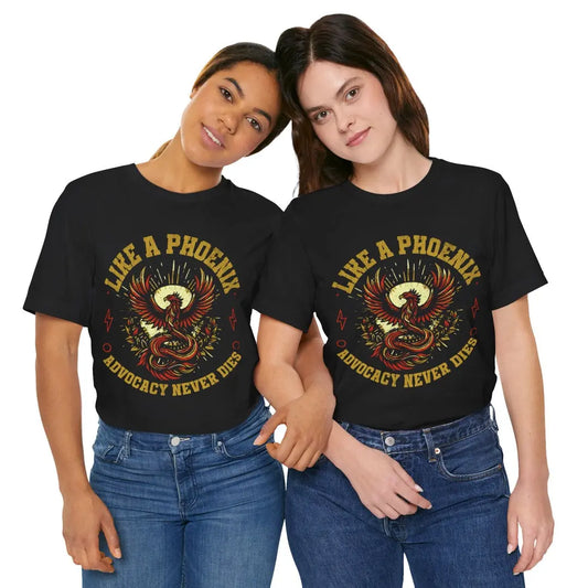 Two women wearing matching Advocacy Never Dies phoenix t-shirts