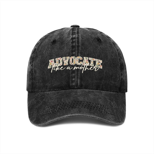 Black washed cotton baseball cap with the cream Advocate Like a Mother print, front view